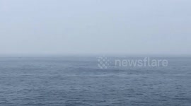 Iranian speedboats harass US aircraft carrier and destroyer