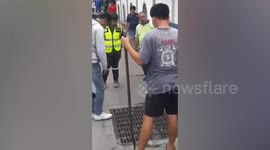 Bungling 'drug dealer' rescued by police after getting stuck in drain during chase