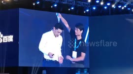 'What's your problem?!' Baidu CEO has water poured over him at event in Beijing
