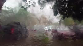 Tropical rainstorm viewed from my car windscreen.