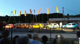 Freshly painted cars dry on a clothesline