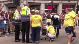 A woman has sat on Oxford circus and blocked Pride Parade in London