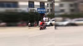 Six people ride on one scooter to test its capacity in China