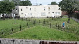 Council in Scotland installs 'prison’ fence to stop kids playing soccer on grass outside homes