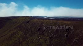 Holiday-maker snaps shocking images of huge fire sweeping Saddleworth Moor, Manchester, from plane as 30 homes are evacuated