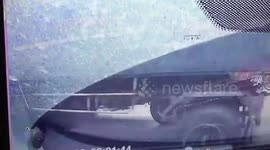 Miracle moment motorcyclist survives after being run over by truck