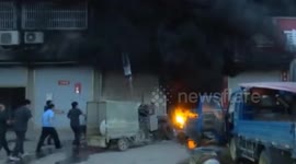 Terrified people jump from first-floor window to escape fire in China