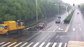 Car slams into utility pole trailing from truck in China's Changshu