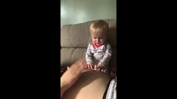 Baby eats dads belly button lint..