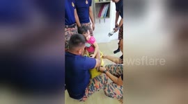 Little girl rescued after getting foot stuck in cooking gas tank in Malaysia
