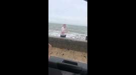 Son gets drenched by huge wave