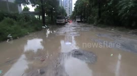 Road terrible and crazy in Vietnam with hundreds of very large puddles