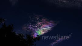 Bright rainbow colored iridescent cirrus cloud 6x timelapse V10851a