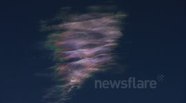 Strange ripply iridescent pink cirrus cloud timelapse (zoomed) V10852a
