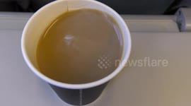 Flight is bumpy, coffee cup is unstable, hot coffee can scald