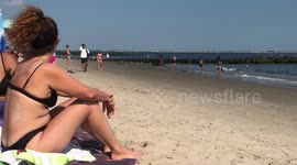 NEW YORKERS OCCUPIED BEACHES TO SURVIVE EXTREME HEAT