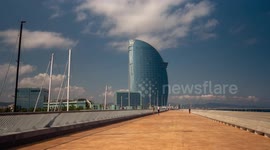 hyper lapse POV shot along the promenade towards the W hotel in barcelona