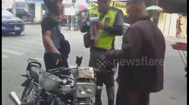 Wrong place! Motorcyclist fined after being caught wearing RICE POT as a helmet