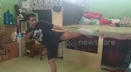 Punching pad and phone hit filmer's face while filming kicking practise in Indonesia