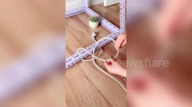 Incredible life hack! Chinese woman shows how to free plug cable trapped under table