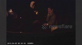 Shocking video shows racist teens bashing concrete block on windscreen of school security's car after beating him up