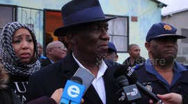 South African police minister makes statement after visiting family of slain officer
