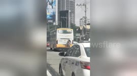 Philippines man dubbed 'Spider-Man' catches free ride on bus