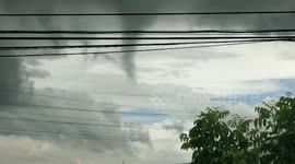 Terrified resident watch tornado rip through homes and a school in the Philippines