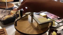 This machine shows an outstanding way to slice the perfect slice of cheese