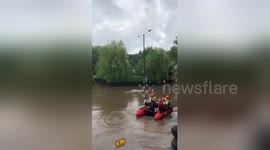 Newsflare Edit - Rescue boat in Manchester saving residents from rising flood water
