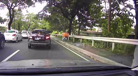 Filipino moped rider crashes after attempting to dodge traffic on sidewalk