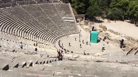 Funny moment of tourist performance in the Greek famous Epidavros Arene.