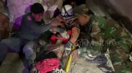 Cambodian man rescued after spending four days wedged between rocks in a cave