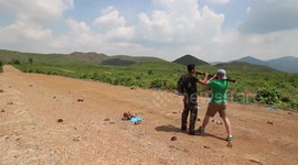 Guy fires an RPG in Cambodia, blowing up a tree