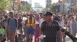 Thousands of people enjoying opening day if the Taste of the Danforth Greek food festival in Toronto