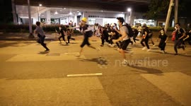Protesters running from charging riot police in Kwun Tong