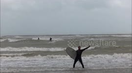 Surf's up in Brighton as high winds batter UK