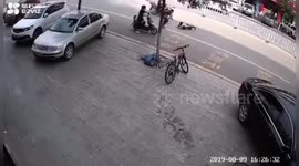 Chinese boy almost gets run over after riding segway on a road