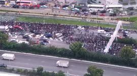 Thousands of Hong Kong protestors block oncoming traffic leaving protest at airport