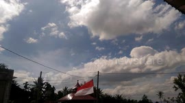 timelapse beautiful clouds and indonesian flag