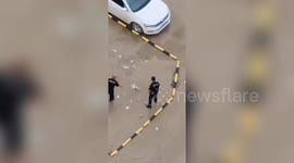 Security guards in China smash glass bottles on ground to 'stop residents parking there'