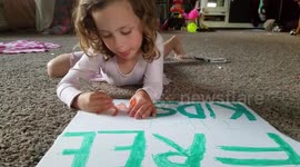 Young Child Colors Protest Sign - 