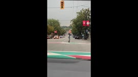 Cyclist filmed 'surfing' on his BMX in middle of Canadian road