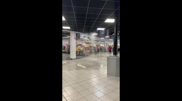 Water pouring through roof in Luton airport