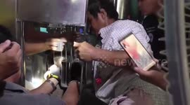 Thai worker rescued after getting hand stuck in water bottling machine