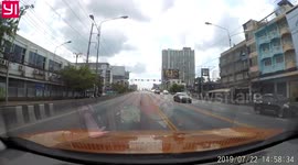 'Lucky' puppy inches from being knocked over after running loose on busy Thai road