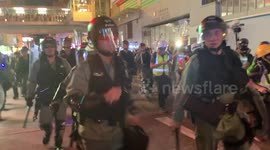 HOng Kong riot police push filmer