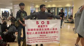Hong Kong medic with SOS sign