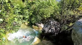 Trekkers make incredible jump into 'natural jacuzzi' in Bosnian valley