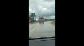 Broken bus drives diagonally on Thai motorway